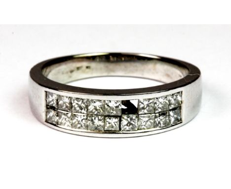 A white metal (tested 18ct gold) ring set with princess cut diamonds (1 stone missing). (P.5) approx. 4.8g.  Please note this