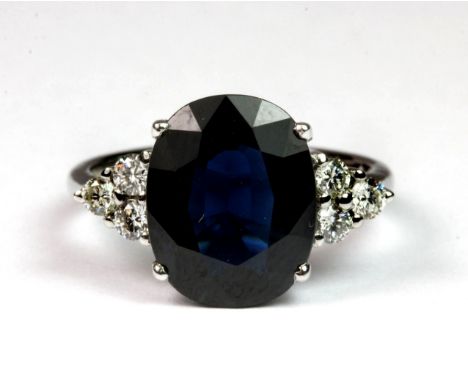 An 18ct white gold (stamped 750) ring set with a sapphire and diamonds. (H). Please note this lot is a credit card reclaim it