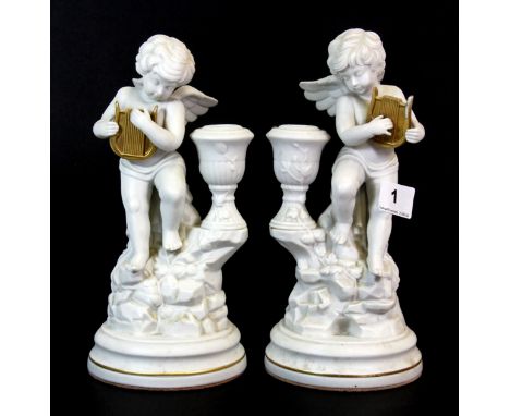 A pair of Amorini De Pompeii white bisque porcelain cherub figures, H. 23cm.