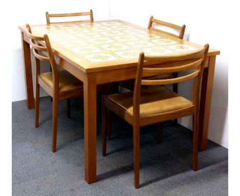 A 1970's tile topped teak dining table and four chairs, 136 x 96cm.