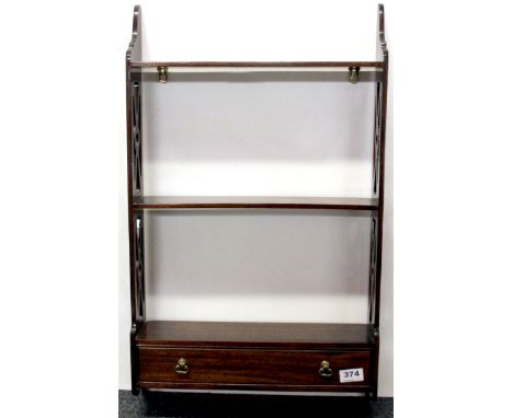 A small mahogany wall shelf, H. 69cm, W. 41cm.