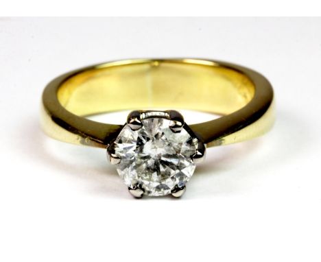 An 18ct yellow and white gold (worn 750 mark) ring set with a solitaire diamond (approx 1.25ct). (N.5).  Please note this lot