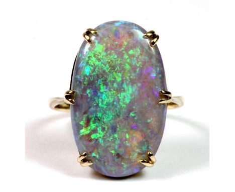 A yellow metal (tested 18ct gold) ring set with a large natural blue opal, opal size 2 x 1.8cm (J).