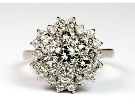 An 18ct white gold (stamped 18ct) diamond cluster ring (approx. 2ct total). (O.5), approx. 5.8g.  Please note this lot is a c