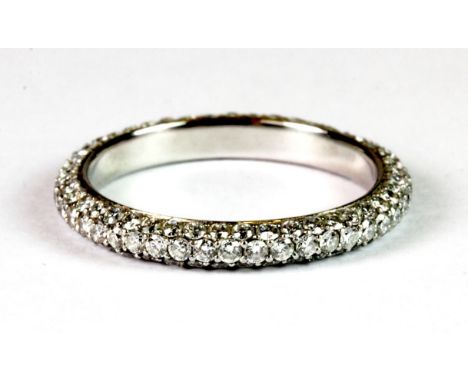 A platinum and diamond full eternity ring. (K), approx 2.8g, 1 diamond missing.