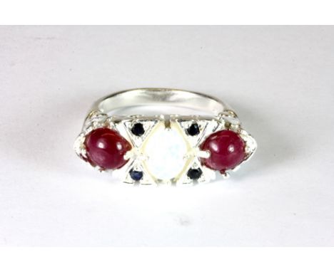 A 925 silver Art Deco inspired ring set with a stunning fire opal, cabochon rubies and sapphires, by Hana Maae.