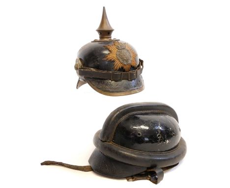 German WWI pickelhaube, stamped Ernst Slegemund Dresden 1914, also a German dispatch rider's helmet stamped 59 1/2 and pen na