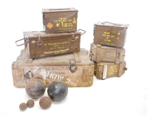 Five cannon balls, approximately 6", 3" and 1.5" one moulded with a letter 'K', also three wood cases for 9 slabs or demoliti
