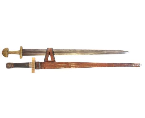 Two Viking replica swords, double-edged blades, one in African tooled leather scabbard.97cm long.