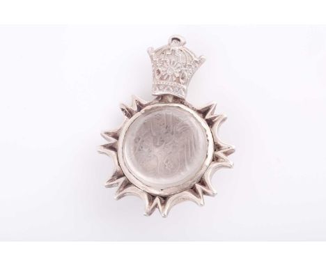 An Indo Persian rock crystal and white metal pendant, with crown shape suspension ring bearing indistinct marks, 3.4 cm wide,