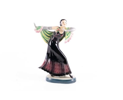 A mid-20th century ceramic figure of a dancer, Art Deco style, painted in polychrome enamels on an oval base, 31 cm high, imp