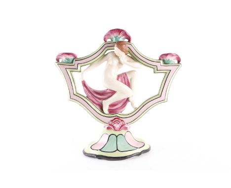 A Royal Dux Art Deco ceramic three-sconce candlestick, modelled with a nude female dancer, on a lobed, spreading foot, impres