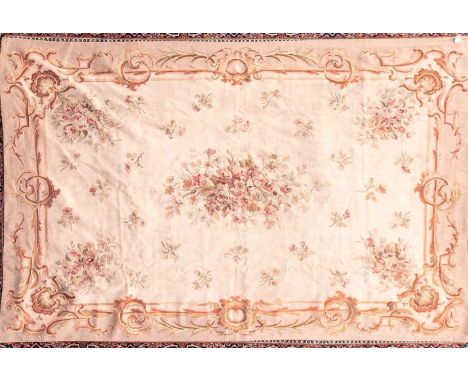A 20th century ivory ground Aubusson style tapestry carpet with a central spray of roses within a scroll border. 287 cm x 185