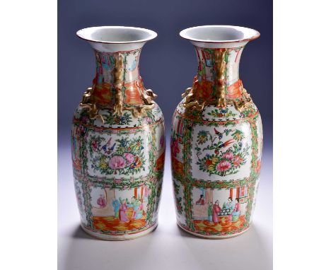 A pair of Canton enamel vases, Qing, 19th century, the flared rim above gilt shi-shi handles and chilong, painted with panels