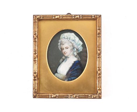 Early 19th-century school, a portrait miniature on ivory, a smartly dressed lady in a blue shawl, 9 cm x 7 cm, glazed in a gi