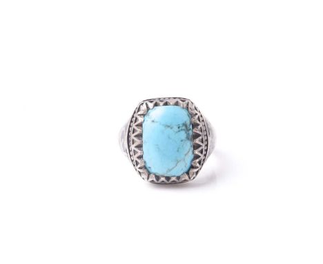 An Eastern niello decorated (925) silver and turquoise gentleman's ring set with a single rectangular cushion form stone.Cond