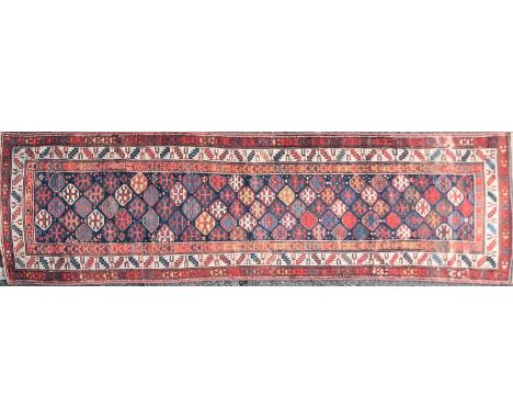 A late 19th century/ early 20th-century dark blue ground Caucasian possibly Gendje carpet runner. With an all-over pattern of