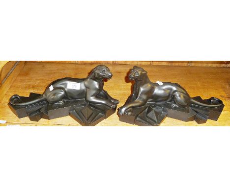 Art Deco style matt black composite jaguars, signed as P. Trudeau