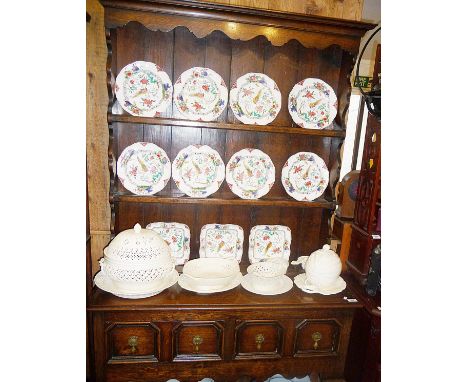 Small Edwardian 18th c. style oak dresser with two shelf plate rack above base with two drawers having brass drop handles and