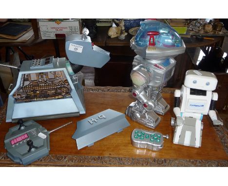 A vintage remote control K9 robot from BBC's Dr. Who, and two other robots