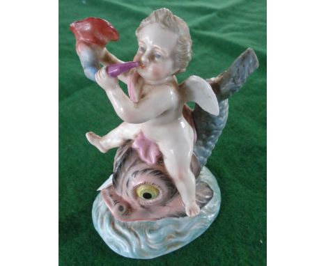 19th c. German porcelain figure of a putti riding a dolphin (A/F), blue painted "R" mark to base