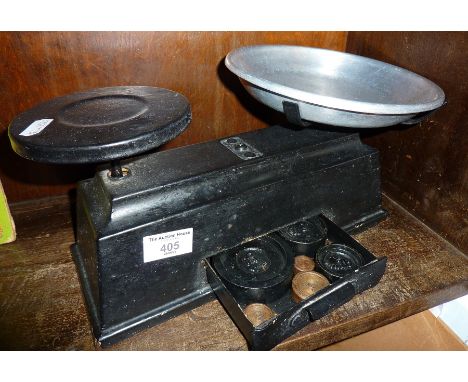 Old metal kitchen scales with weights inside integral drawer