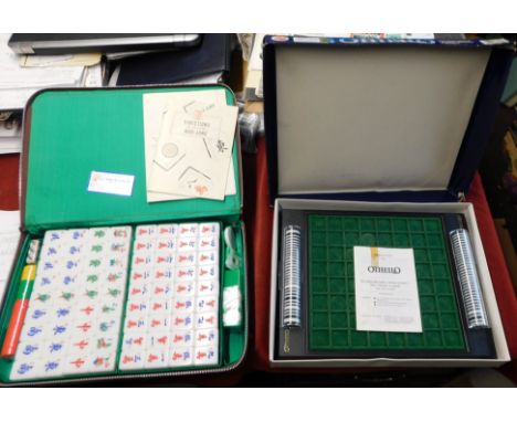 Games. Mahjong tile based game, with rules in case. Very good condition. PLUS Othello strategy game. Worn box, game in very g