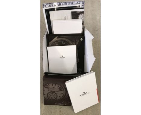 A box of watch catalogues and magazines. To include Patek Philippe, Rolex and Zenith. Please Note: All enquiries will be resp