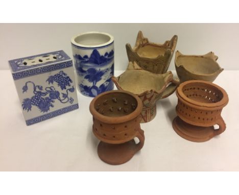 Blue & white oriental ceramic opium pillow and brush pot. Together with 5 pieces of tribal pottery. Please Note: All enquirie