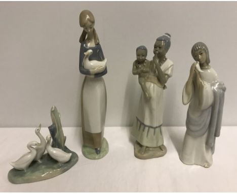 A group of 4 Spanish style porcelain figurines to include Nao. Comprising of: Nao girl holding a duck, Nao group of geese (on