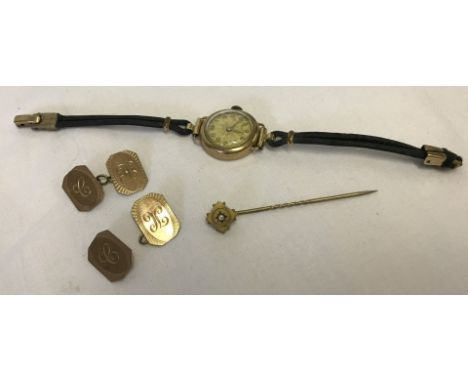 A Victorian gold stick pin, a ladies vintage 9ct gold cased watch, and 9ct gold cufflinks (a/f). Stick pin set with a single 