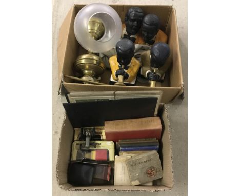 2 boxes of mixed items. To include brass oil lamp, ceramic jazz musicians, bone letter opener with stanhope, books (including