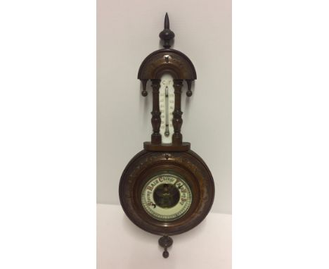 Victorian wooden cased wall-hanging barometer. Has thermometer built in. Approx 46cm tall. Please Note: All enquiries will be
