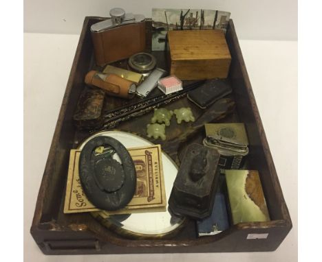 A tray of assorted misc items. To include jade turtles, vintage lighters, and hip-flask. Please Note: All enquiries will be r