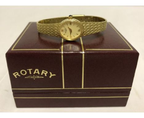 A ladies boxed gold plated Rotary watch. With blue cabochon stone set in winder.  Not working - possibly requires a new batte