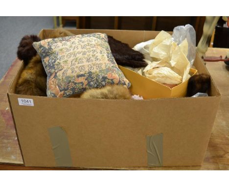 A group of textiles including three dolls, fur stoles, machine woven rug, etc