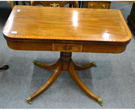 A cross banded mahogany fold over card table 