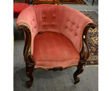 A Victorian carved mahogany framed button back chair 