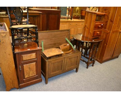 A mahogany and walnut pot cupboard, an oak stool, oak magazine rack, oak blanket box, and a gate leg table 