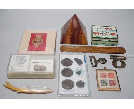 ° ° A collection of collectibles: a mother of pearl carves fish, a Mauchlin postal ruler, an enamel box and trays, coinage an