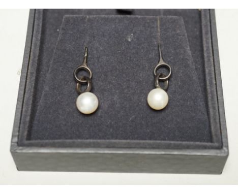 A modern pair of Georg Jensen silver and cultured pearl set drop earrings, 31mm, in Georg Jensen box.