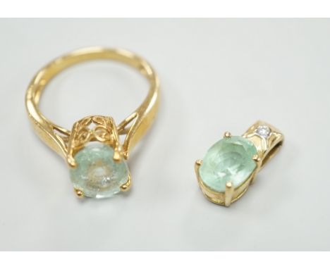 A modern 18k Pariba, tourmaline and diamond set pendant, 15mm, and an 18k and Pariba tourmaline set ring, size M/N, gross wei