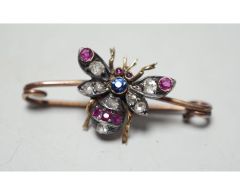 A late Victorian yellow metal, ruby, sapphire and diamond set bug brooch, 30mm, gross weight 2.2 grams.