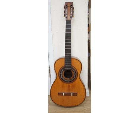A 19th century Spanish parlour guitar labelled Antonio Carlos Garcia, Madrid. The back 46.5cm excluding button. Lacking strin