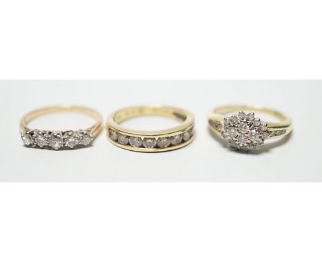 Two modern 18ct gold and diamond set rings, including nine stone channel set, size L and diamond cluster, size L and a yellow