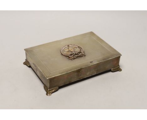 An Elizabeth II engine turned silver rectangular cigarette box, with yellow metal applique and interior inscription relating 