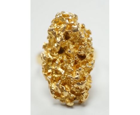 An African yellow metal nugget ring, size M/N, 15.3 grams.