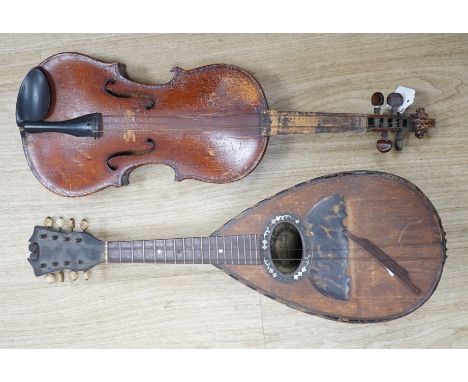 An Italian balloon back mandolin with tortoiseshell overlay, circa 1900, label for Pietro Tonelli of Napoli together with a v