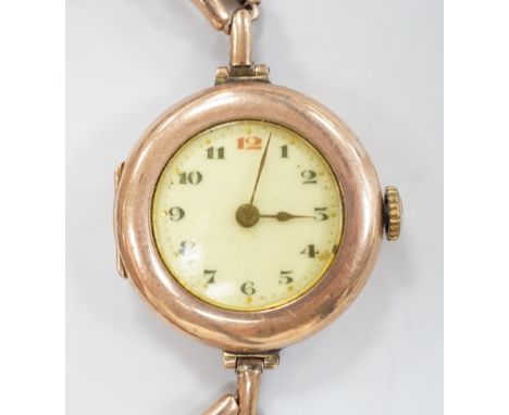 An early 20th century 9ct gold Rolex manual wind wrist watch, with Arabic dial, case diameter 27mm, on an expanding yellow me