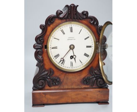 Mason, Ipswich. A 19th century mahogany cased mantel clock with scrolling moulded decoration - 31cm tall